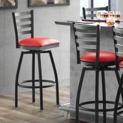 Lancaster Table & Seating Black Finish Ladder Back Swivel Bar Stool With 2 1/2" Red Vinyl Padded Seat